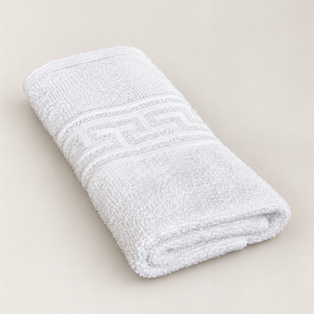 Prosop alb Madhome.ro din bumbac 100%, densitate 500 gsm, cu bordură grecească elegantă și cusături duble rezistente