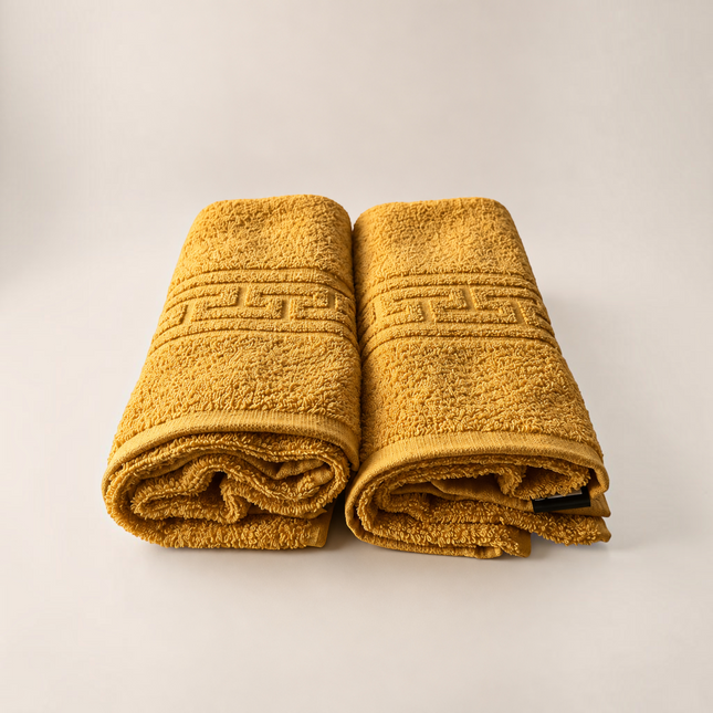 Set de 2 prosoape Madhome.ro muștar din bumbac 100% cu bordură grecească, 50x80 cm și densitate 500 g/mp