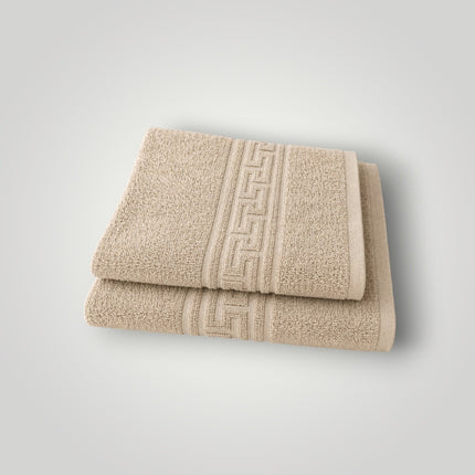 Madhome.ro set of two beige cotton towels with a decorative Greek key border design, stacked on a white background.