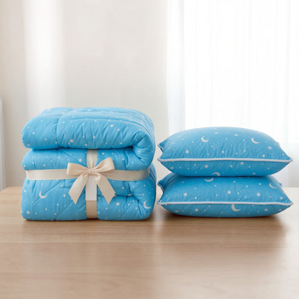 Madhome.ro light blue quilted bedding set with star and moon pattern, including a folded duvet and two pillows.