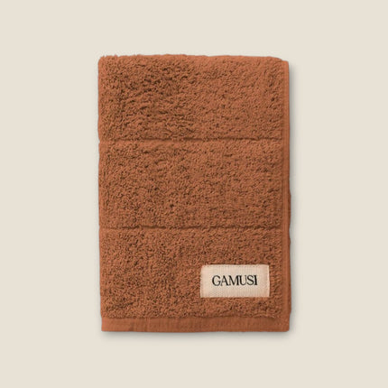 Madhome.ro soft brown cotton bath towel with a textured finish and branded label