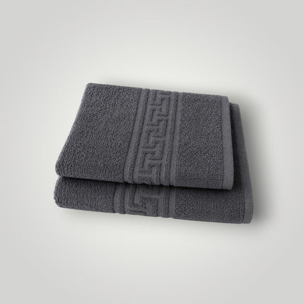Madhome.ro set of two grey cotton towels with a Greek key border design, featuring a soft, absorbent texture.