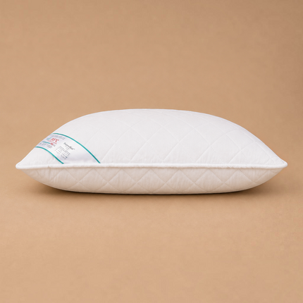 Madhome.ro HypoallergenicMed white quilted pillow with side view, featuring a label for 95°C machine washing.