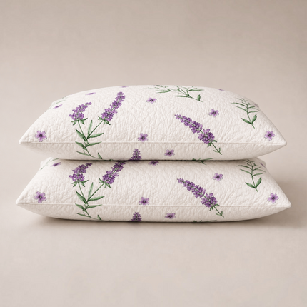 Madhome.ro set of two low-profile quilted pillows with a lavender floral print on white microfiber fabric.