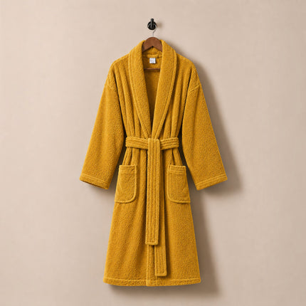 Madhome.ro mustard yellow cotton velour bathrobe with shawl collar, waist tie, and two pockets, hanging on a hanger.
