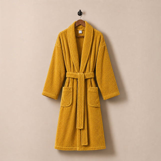Madhome.ro mustard yellow cotton velour bathrobe with shawl collar, waist tie, and two pockets, hanging on a hanger.