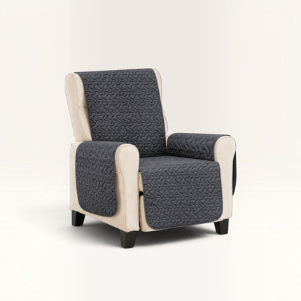 Madhome.ro quilted armchair cover in dark grey with a textured pattern, draped over a beige upholstered armchair.