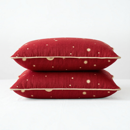 Madhome.ro red decorative pillows with gold star and moon patterns stacked on a white surface