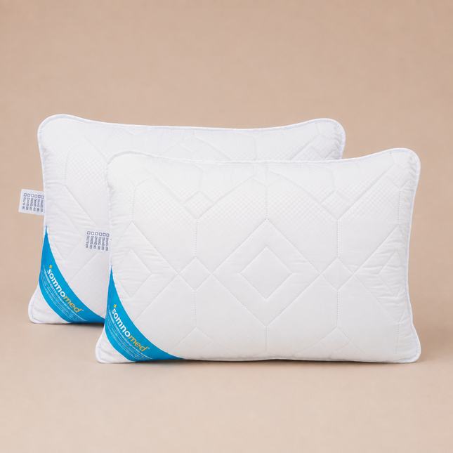 Madhome.ro set of two white quilted antimicrobial pillows, 50x70 cm, hypoallergenic and washable at 95 degrees Celsius.