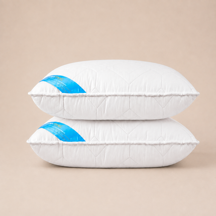Madhome.ro set of two white quilted antimicrobial pillows, 50x70 cm, made with hypoallergenic polyester fiber filling.