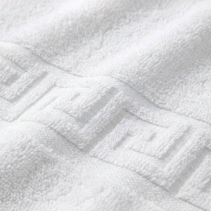 Madhome.ro white 100% cotton hotel towel featuring a textured Greek key border pattern