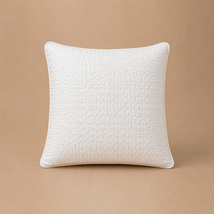 Madhome.ro white quilted microfiber pillow with reinforced edges and soft silicone down filling on a beige background