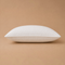 Madhome.ro white quilted microfiber pillow with silicone down filling and reinforced edges on a beige background