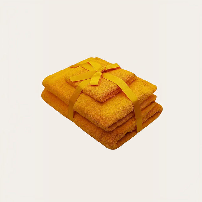 Madhome.ro set of three yellow 100% cotton towels in different sizes tied with a matching ribbon